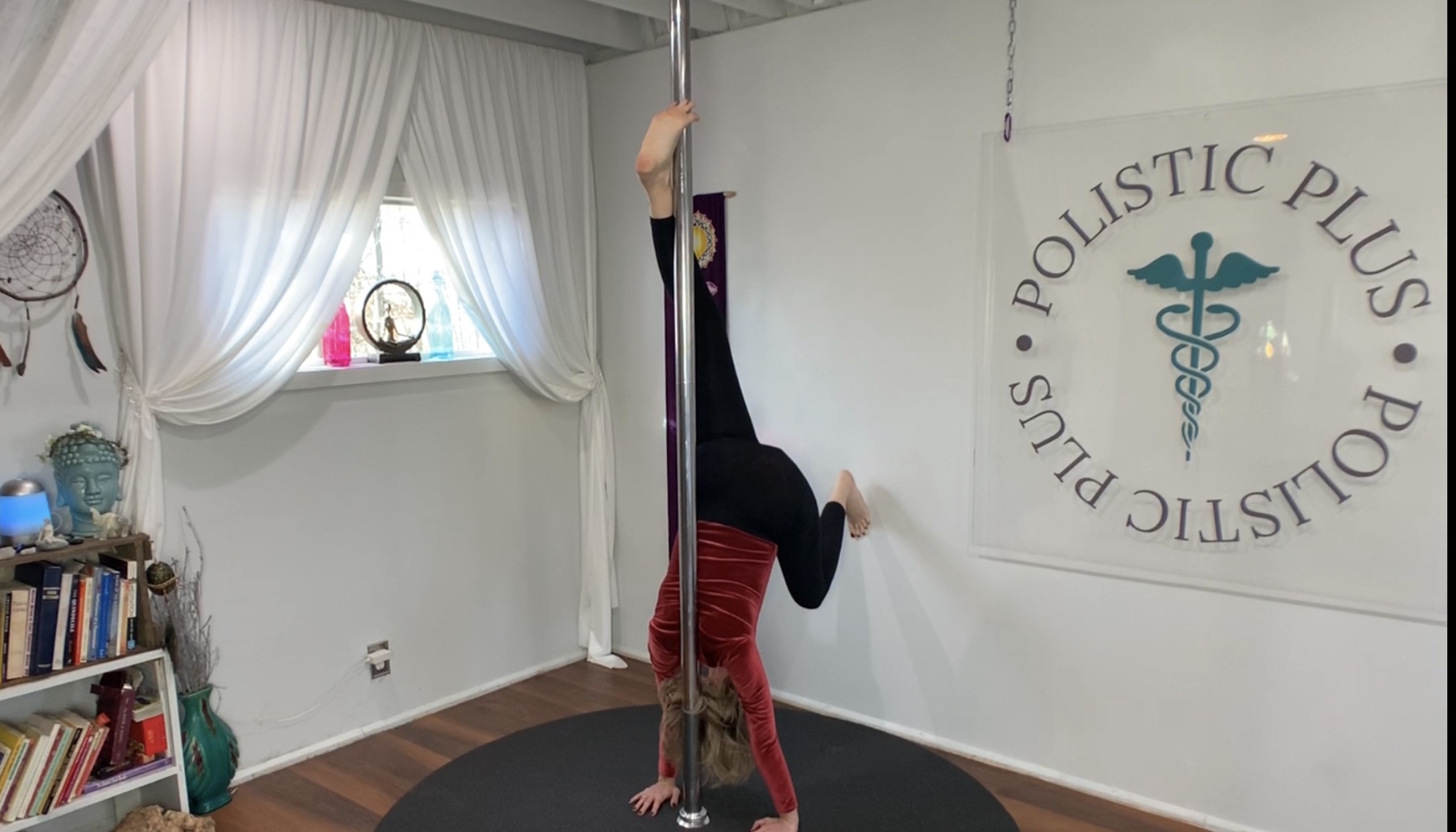 Pole Yoga Handstand Pose using the wall.